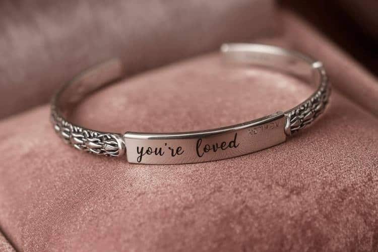 engraved bracelet for retired woman that says "you're loved"