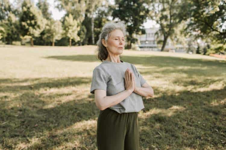 older woman meditating