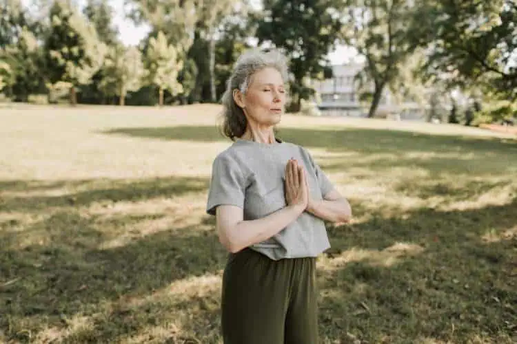 older woman meditating
