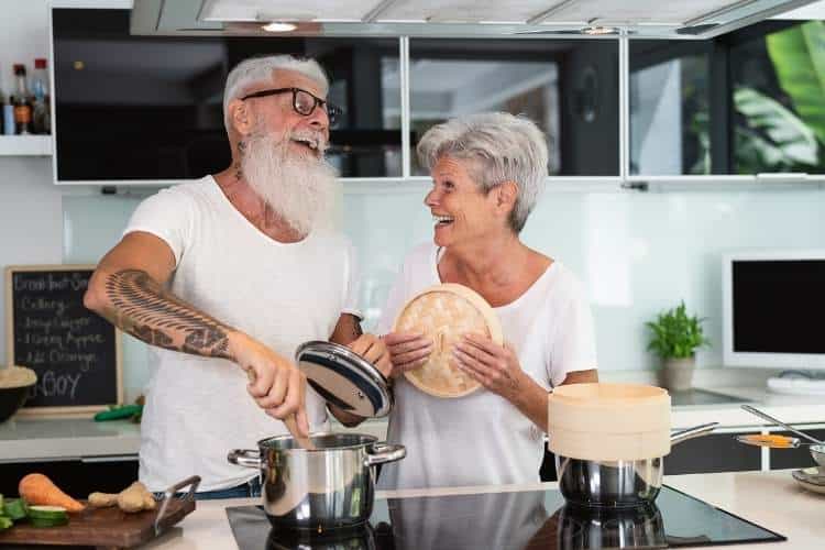 Retired couple cooking